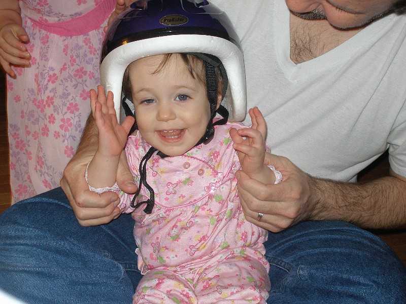 daddy_holding_helmet_girl.jpg